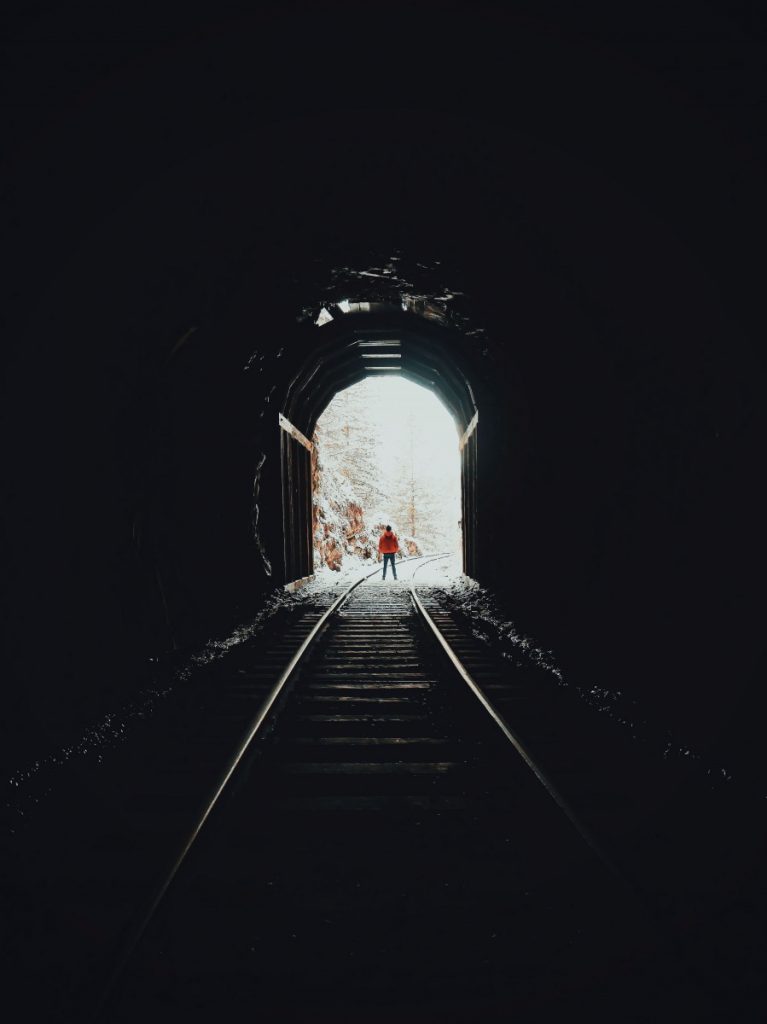 person standing on train track